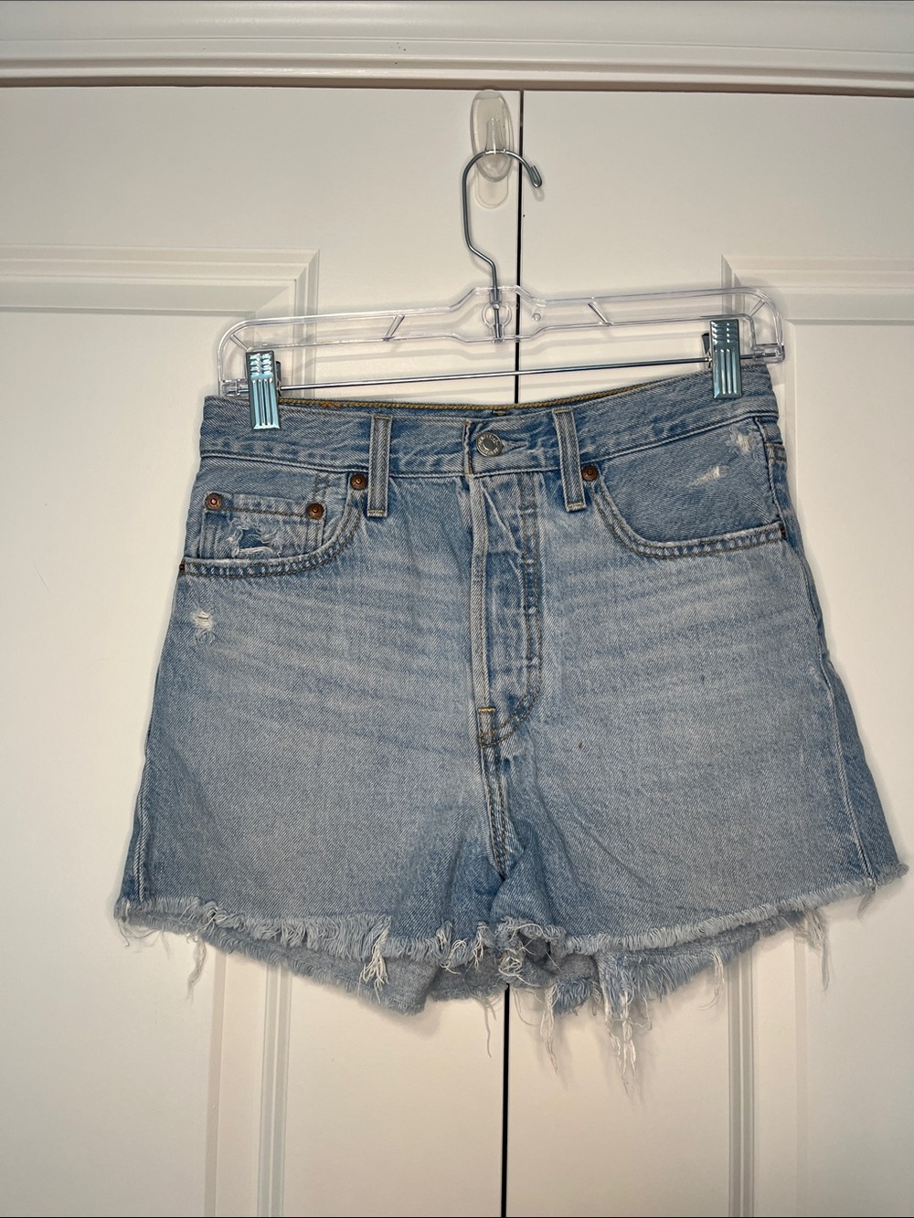 Levi’s High-Rise Ribcage Light Blue Denim Jean Shorts with Frayed Hem